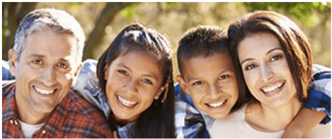 Portrait of hispanic family In countryside