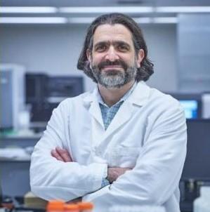 Adam Resnick in a lab coat